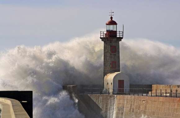 A Huge Wave Crashing Over A Lighthouse