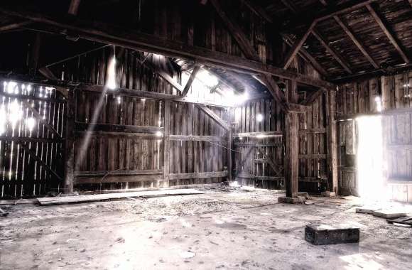 Light shines in the ruined barn