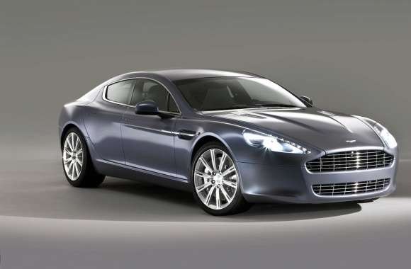 Silver Aston Martin Rapide with headlights on